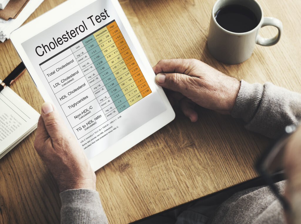 A man is holding a tablet with the word ordinal test on it.